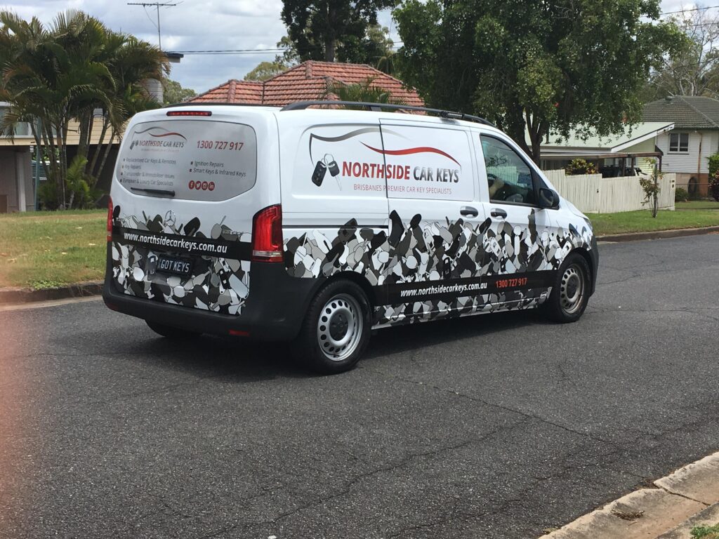 Northside Car Keys Van Picture of Northside Car Keys van driving rear view