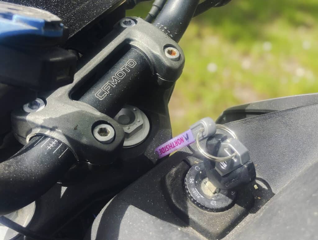 Replacement CF Moto key inserted into ignition of 2023 CF Motor 300 NK motorcycle, provided by Northside Car Keys
