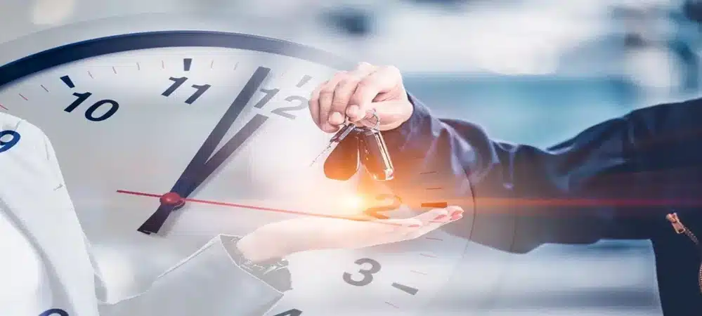 Fast response auto locksmith handing over replacement car keys in front of a clock overlay by Northside Car Keys.